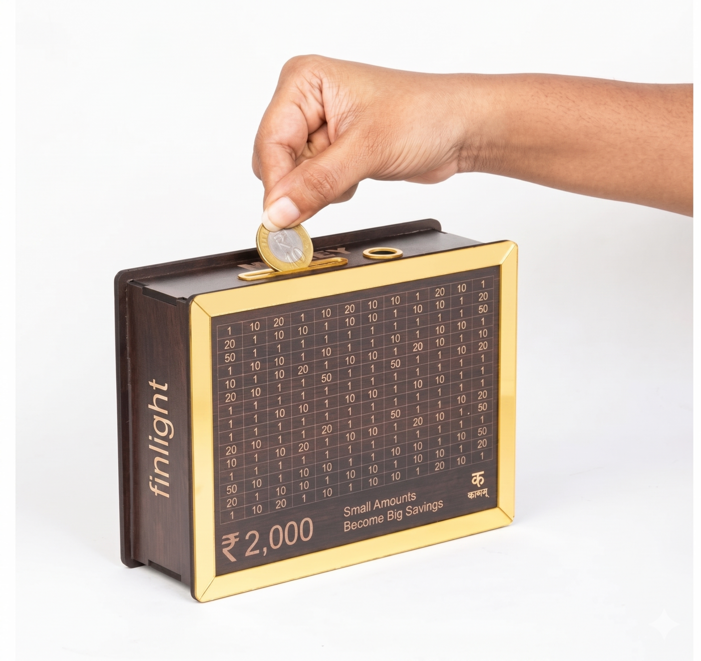 The FinLight Gullak — a handcrafted wooden savings box etched with a ₹2,000 savings grid, with a hand inserting a coin through the slot on top