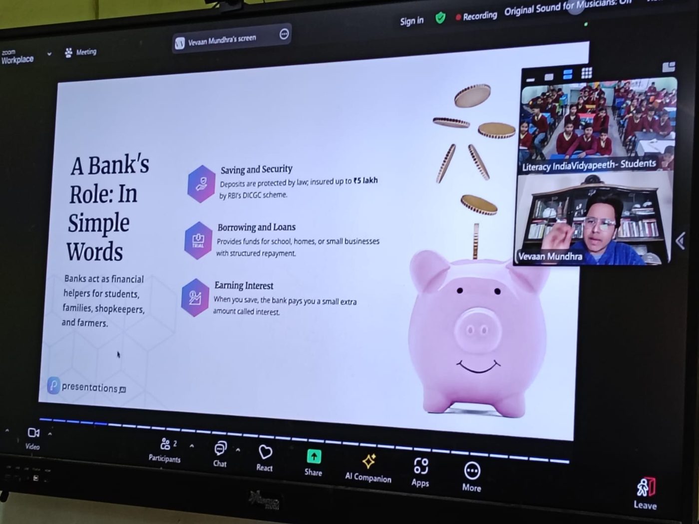 A banking curriculum slide on the classroom screen